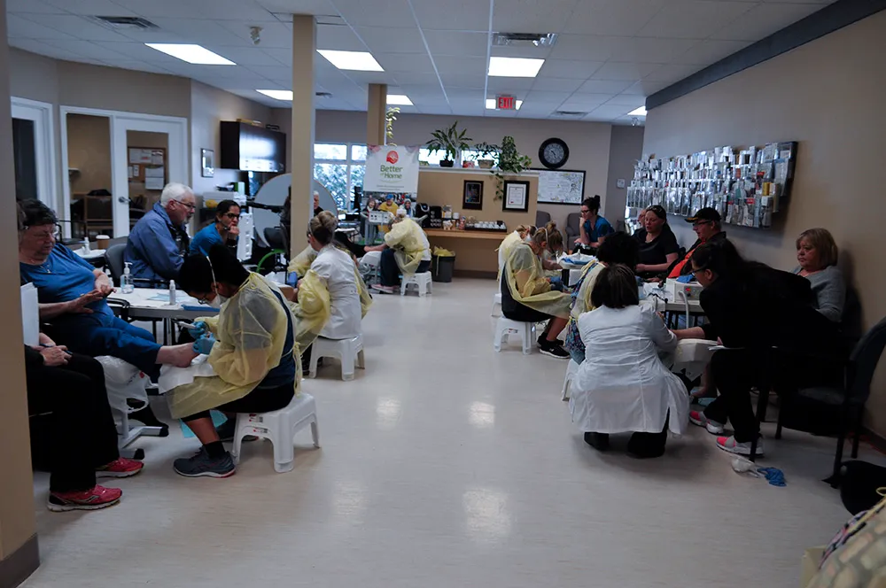 Nurses practising foot care in a supervised clinical session